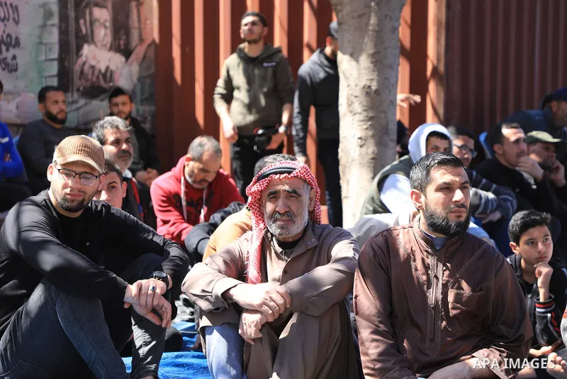 Palestinians attend Friday prayer in front of Red Cross office to support prisoners in Israeli jails, in Gaza city on March 17, 2023. Thousands of Palestinian political prisoners in Israeli prisons continue their civil d...