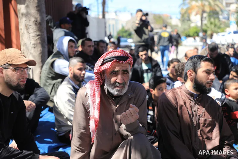 Palestinians attend Friday prayer in front of Red Cross office to support prisoners in Israeli jails, in Gaza city on March 17, 2023. Thousands of Palestinian political prisoners in Israeli prisons continue their civil d...