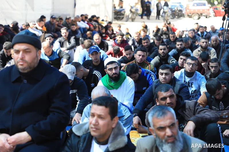 Palestinians attend Friday prayer in front of Red Cross office to support prisoners in Israeli jails, in Gaza city on March 17, 2023. Thousands of Palestinian political prisoners in Israeli prisons continue their civil d...