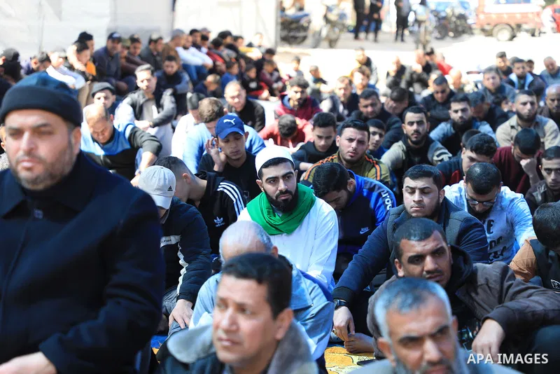 Palestinians attend Friday prayer in front of Red Cross office to support prisoners in Israeli jails, in Gaza city on March 17, 2023. Thousands of Palestinian political prisoners in Israeli prisons continue their civil d...