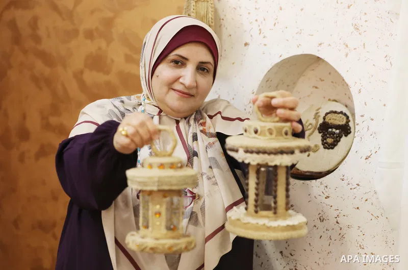 Palestinian woman, Raghda Abu Assi makes handicrafts from burlap at her home in Gaza city on August 14, 2023. A family project in which all family members have been working for more than 27 years, using burlap to revive...