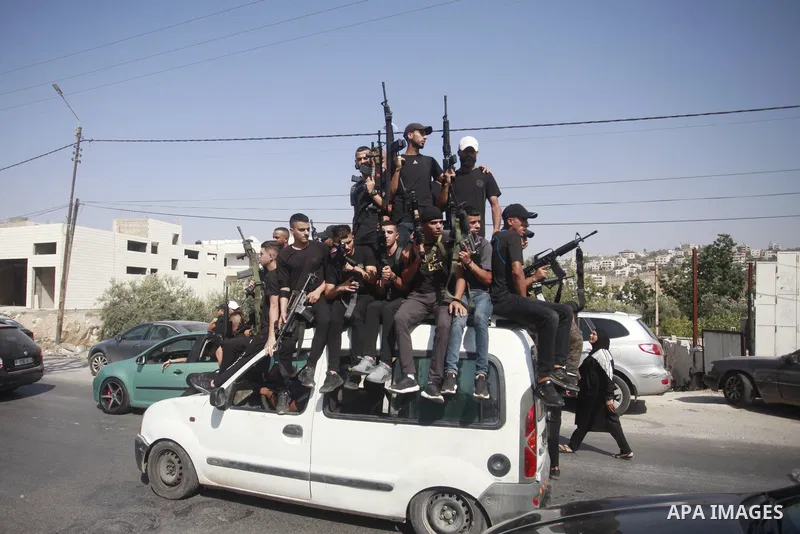Palestinians carry the body of Mohammad Abu Asab, 19, who was killed during an Israeli raid, during his funeral in the West Bank city of Nablus on August 19, 2023. A Palestinian youth critically injured three days ago by...