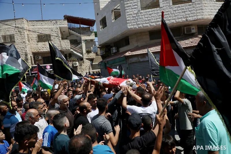 Palestinians carry the body of Othman Abu Khurog, 17, during his funeral procession at Zababdeh village near Jenin in the West Bank, on August 22, 2023. Abu Khurog was killed when clashes erupted in Zababdeh, which Israe...