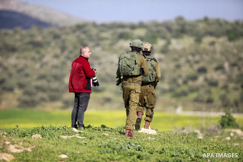 Israeli forces search Palestinian vehicles in search of Palestinian gunmen accused of shooting at Israeli army , at Israeli checkpoints in the northern West Bank on March 27, 2023. Photo by Mohammed Nasser\ apaimages