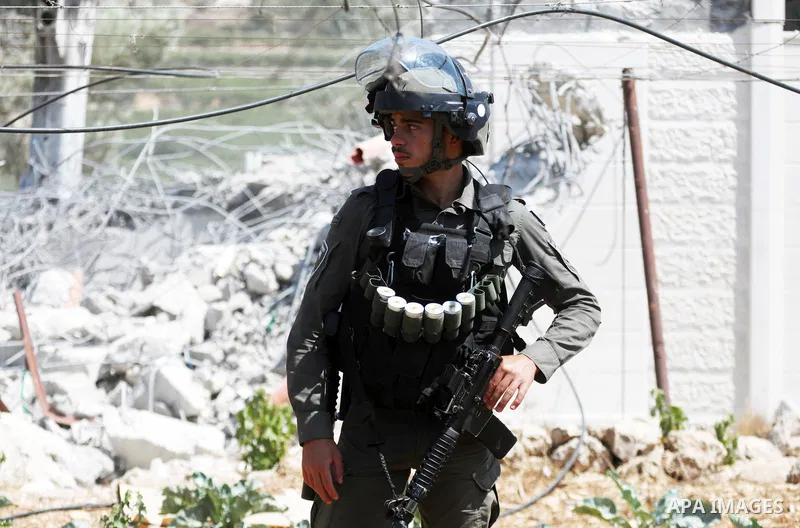 Israeli bulldozers demolish a Palestinian house built without a permit from the Israeli authorities in the area C, which lies under Israel's military control since 1967, in Hebron in the West Bank on August 29, 2023. The...