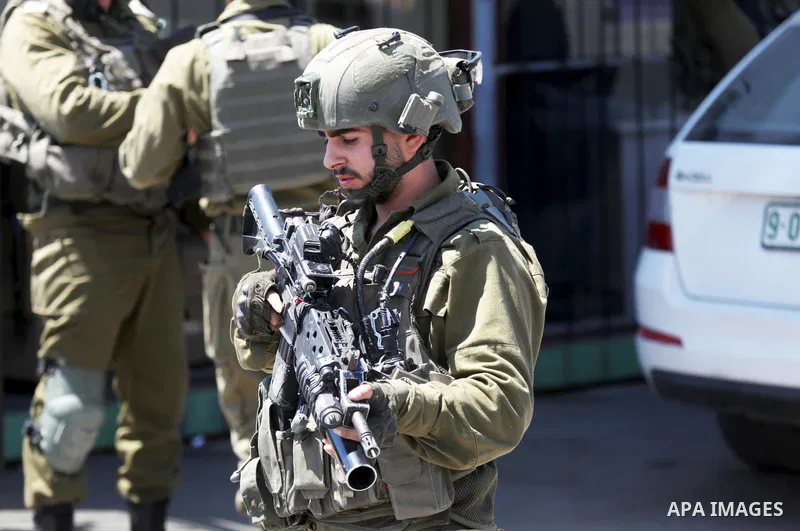 Israeli forces keep guard at the scene of what the Israeli military said is a ramming attack in the West Bank city of Hebron on August 30, 2023. Israeli forces Wednesday shot and injured a Palestinian, south of the West...