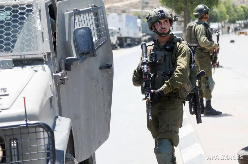 Israeli forces keep guard at the scene of what the Israeli military said is a ramming attack in the West Bank city of Hebron on August 30, 2023. Israeli forces Wednesday shot and injured a Palestinian, south of the West...