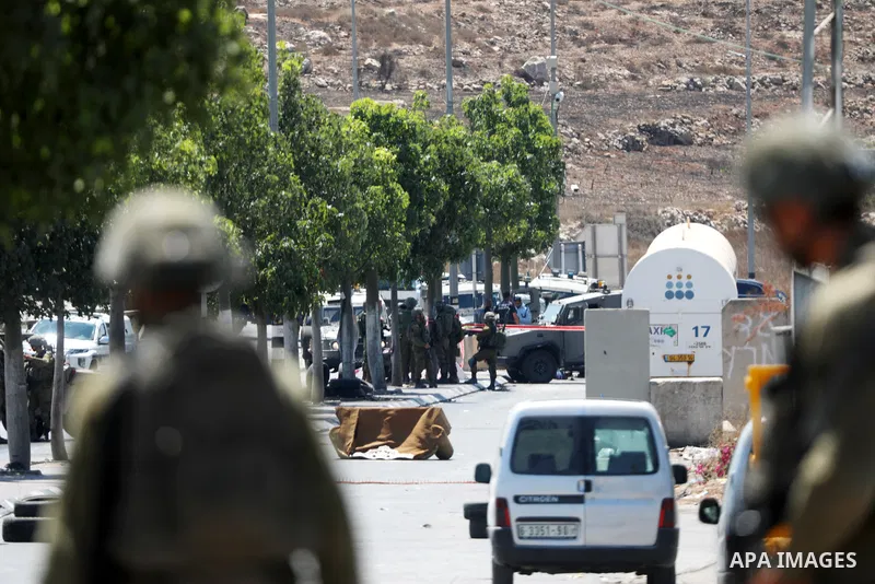 Israeli forces keep guard at the scene of what the Israeli military said is a ramming attack in the West Bank city of Hebron on August 30, 2023. Israeli forces Wednesday shot and injured a Palestinian, south of the West...
