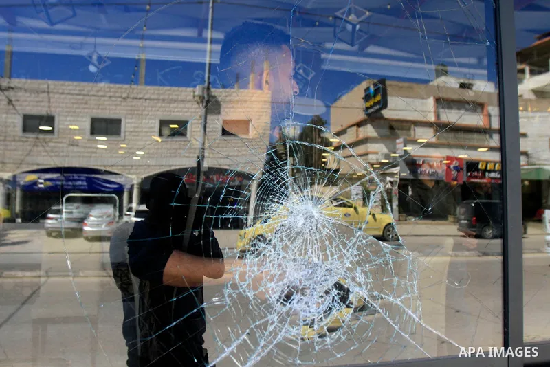 People inspect the damage to a restaurant following a reported attack by Israeli settlers on the Palestinian town of Huwara in the West Bank on March 28, 2023. Photo by Mohammed Nasser\ apaimages