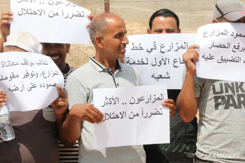 Palestinians farmers take part in a protest against the Israeli blockade, in Al-Bureij refugee camp in the central Strip on August 31, 2023. Gaza’s 2.3 million people are suffering from a 16-year Israeli blockade. Photo...