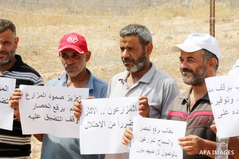 Palestinians farmers take part in a protest against the Israeli blockade, in Al-Bureij refugee camp in the central Strip on August 31, 2023. Gaza’s 2.3 million people are suffering from a 16-year Israeli blockade. Photo...