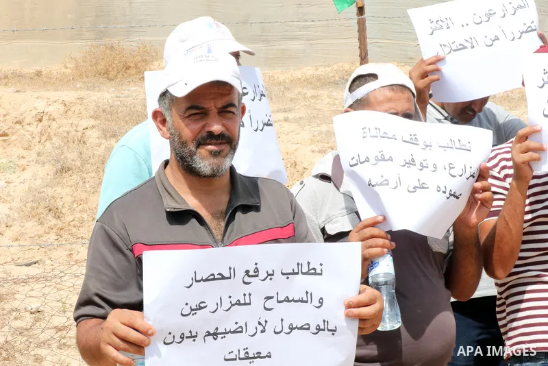 Palestinians farmers take part in a protest against the Israeli blockade, in Al-Bureij refugee camp in the central Strip on August 31, 2023. Gaza’s 2.3 million people are suffering from a 16-year Israeli blockade. Photo...