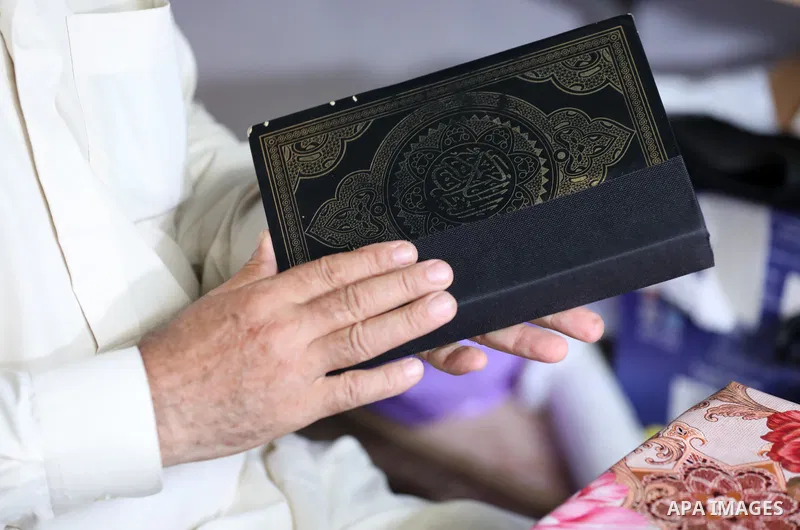 Palestinian men repair and maintain the Holy Qur'an for free in Gaza City on August 31, 2023. Palestinians Raafat Jabr and Rajab Salman, repair and maintain the Holy Qur'an for free at a shop in one of the popular market...