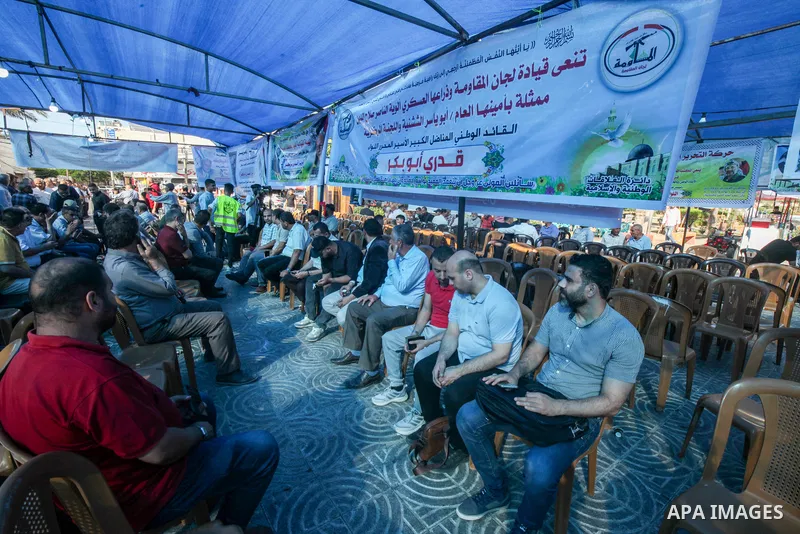 Palestinian mourners take part in the condolence tent Qadri Abu Bakr, the Chairman of the Palestine Liberation Organization (PLO)'s Detainees and Ex-Detainees Commission, who was died previous day in a tragic traffic acc...