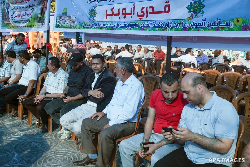 Palestinian mourners take part in the condolence tent Qadri Abu Bakr, the Chairman of the Palestine Liberation Organization (PLO)'s Detainees and Ex-Detainees Commission, who was died previous day in a tragic traffic acc...