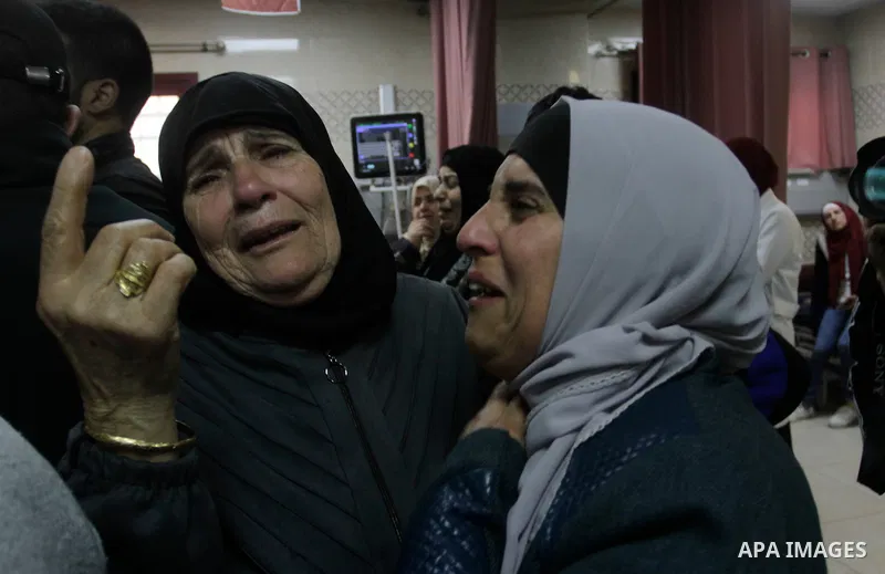 Relatives of Mohammed Abu Bakr, who was killed during clashes with the Israeli army, mourn outside the Rafidiya hospital in the the West Bank city of Nablus on April 3, 2023. Two Palestinian youths have Monday been kille...
