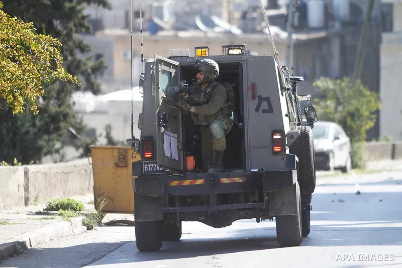 Israeli soldier clash with Palestinians following a raid by Israeli forces in the the West Bank city of Nablus on April 3, 2023. Two Palestinian youths have Monday been killed by Israeli gunfire during a military raid in...