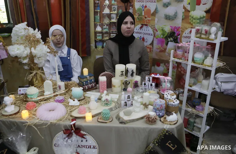 Palestinians attend an exhibition of handicrafts "Jafra Bazaar", in the West Bank city of Hebron on July 10, 2023. Photo by Mamoun Wazwaz \ apaimages