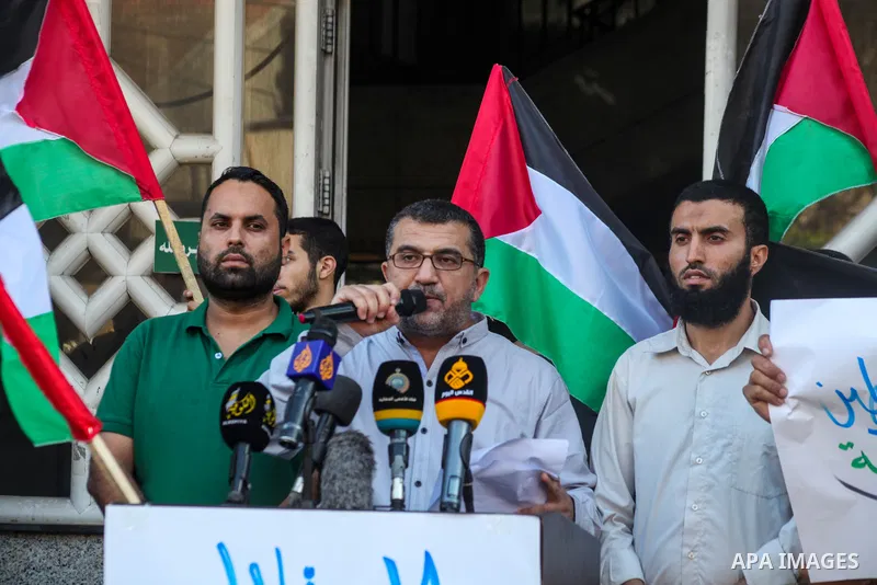 Palestinians take part in a protest against the eviction of the Palestinian Sub Laban family from their home in the Muslim Quarter in Jerusalem's Old City by Israel, to make way for settlers, in Gaza city on July 11, 202...