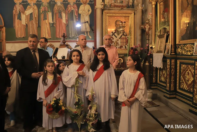Palestinian Christians attend an Orthodox Palm Sunday, at the Church of Saint Porphyrius in Gaza city on April 09, 2023. Palm Sunday is the commemoration of the Entrance of our Lord into Jerusalem following His glorious...