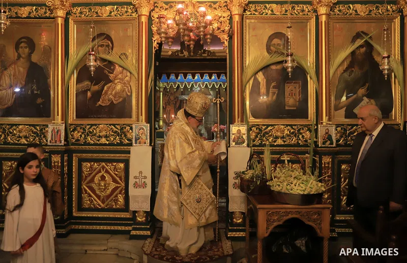 Palestinian Christians attend an Orthodox Palm Sunday, at the Church of Saint Porphyrius in Gaza city on April 09, 2023. Palm Sunday is the commemoration of the Entrance of our Lord into Jerusalem following His glorious...