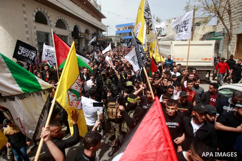 Palestinian mourners attend the funeral of Ayed Slim in his village of Azzun in the West Bank, on April 9, 2023. Israeli soldiers shot dead a Palestinian man in the north of the West Bank on April 8, the Palestinian heal...