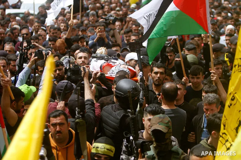 Palestinian mourners attend the funeral of Ayed Slim in his village of Azzun in the West Bank, on April 9, 2023. Israeli soldiers shot dead a Palestinian man in the north of the West Bank on April 8, the Palestinian heal...