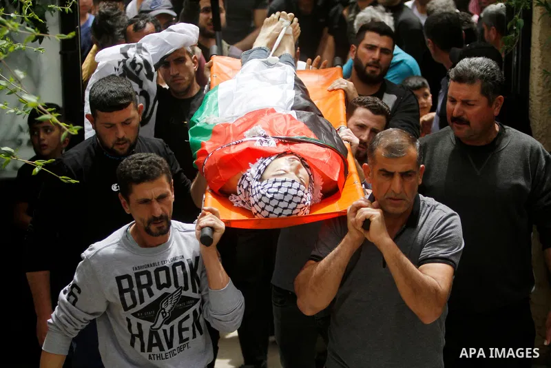 Palestinian mourners attend the funeral of Ayed Slim in his village of Azzun in the West Bank, on April 9, 2023. Israeli soldiers shot dead a Palestinian man in the north of the West Bank on April 8, the Palestinian heal...