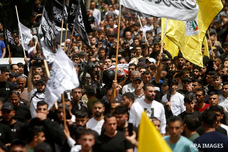 Palestinian mourners attend the funeral of Ayed Slim in his village of Azzun in the West Bank, on April 9, 2023. Israeli soldiers shot dead a Palestinian man in the north of the West Bank on April 8, the Palestinian heal...