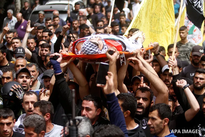 Palestinian mourners attend the funeral of Ayed Slim in his village of Azzun in the West Bank, on April 9, 2023. Israeli soldiers shot dead a Palestinian man in the north of the West Bank on April 8, the Palestinian heal...