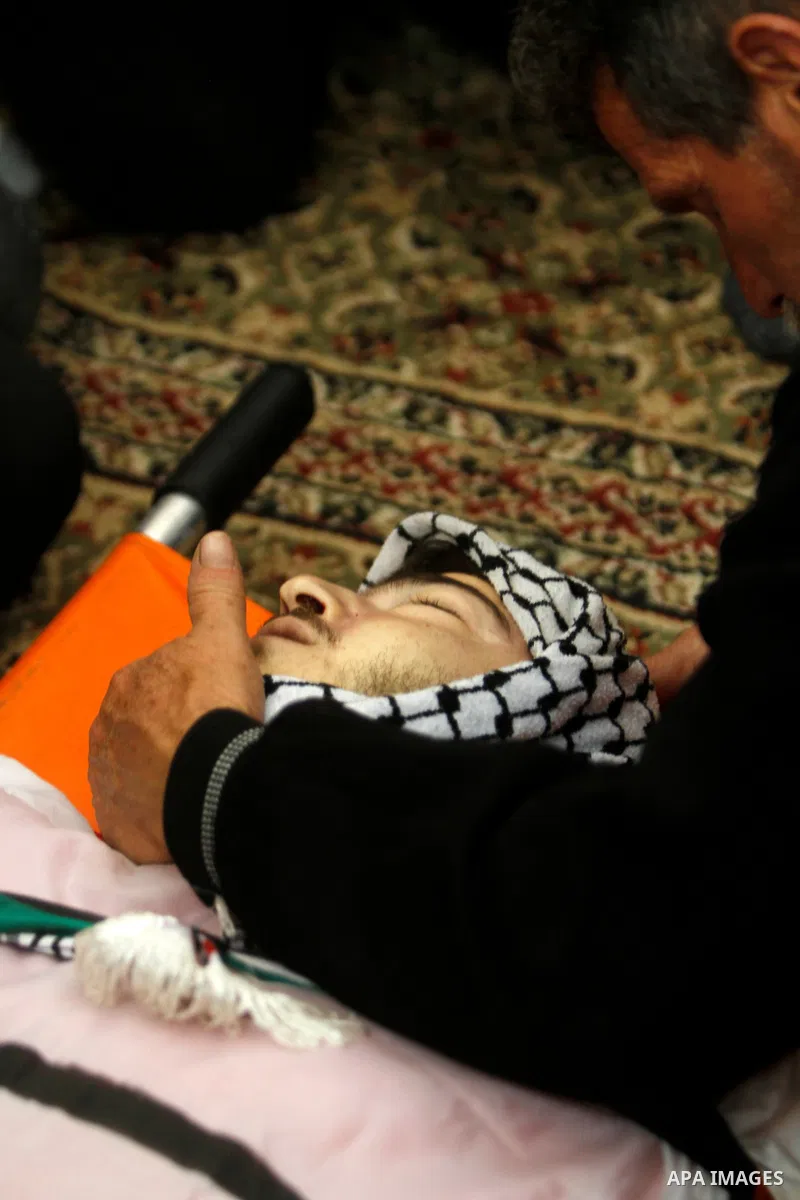 Palestinian mourners attend the funeral of Ayed Slim in his village of Azzun in the West Bank, on April 9, 2023. Israeli soldiers shot dead a Palestinian man in the north of the West Bank on April 8, the Palestinian heal...