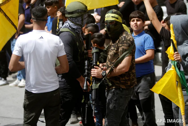 Palestinian mourners attend the funeral of Ayed Slim in his village of Azzun in the West Bank, on April 9, 2023. Israeli soldiers shot dead a Palestinian man in the north of the West Bank on April 8, the Palestinian heal...