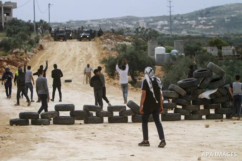 Clashes between Palestinian protesters and Israeli soldiers during a protest in the village of Beita, south of Nablus in the occupied West Bank, on April 10, 2023, against a march by settlers to the nearby Israeli outpos...