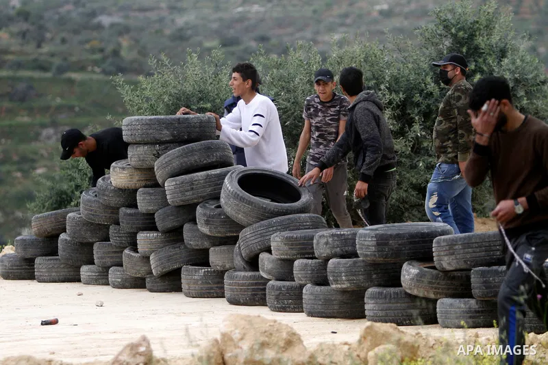 Clashes between Palestinian protesters and Israeli soldiers during a protest in the village of Beita, south of Nablus in the occupied West Bank, on April 10, 2023, against a march by settlers to the nearby Israeli outpos...