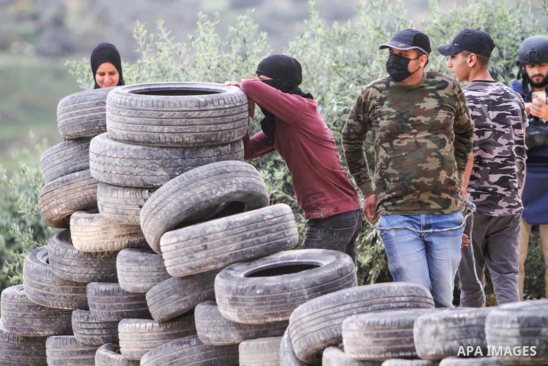 Clashes between Palestinian protesters and Israeli soldiers during a protest in the village of Beita, south of Nablus in the occupied West Bank, on April 10, 2023, against a march by settlers to the nearby Israeli outpos...