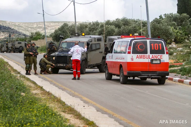Israeli soldiers sweep an area where two Palestinians killed in clashes during an Israeli army operation, near the settlement of Elon Moreh in the West Bank near Nablus on April 11, 2023. Photo by Mohammed Nasser\ apaima...