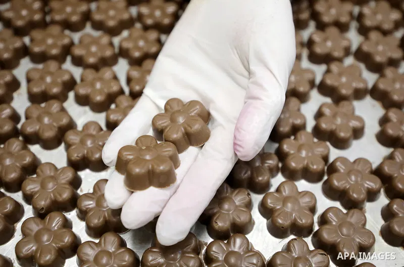 Palestinian workers prepare chocolate for the Eid al-Fitr festival at a chocolate factory in Gaza city on April 12, 2023. Eid al-Fitr is the ended of the holy month of Ramadan by praying during the night time and fasting...