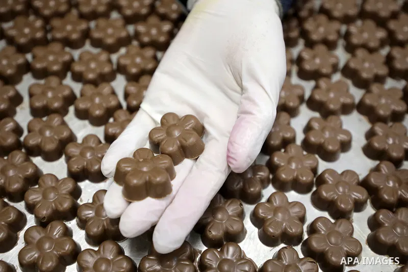 Palestinian workers prepare chocolate for the Eid al-Fitr festival at a chocolate factory in Gaza city on April 12, 2023. Eid al-Fitr is the ended of the holy month of Ramadan by praying during the night time and fasting...
