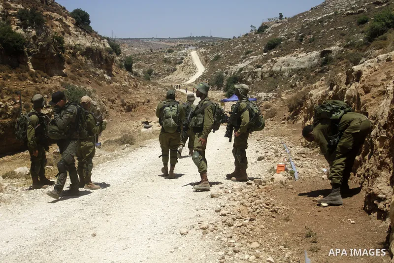 Palestinians take part in a protest following Friday prayer against settlement in the town of Deir Istiya, in the West Bank city of Salfit, on July 14, 2023. Israeli forces denied today access of Palestinian landlords in...