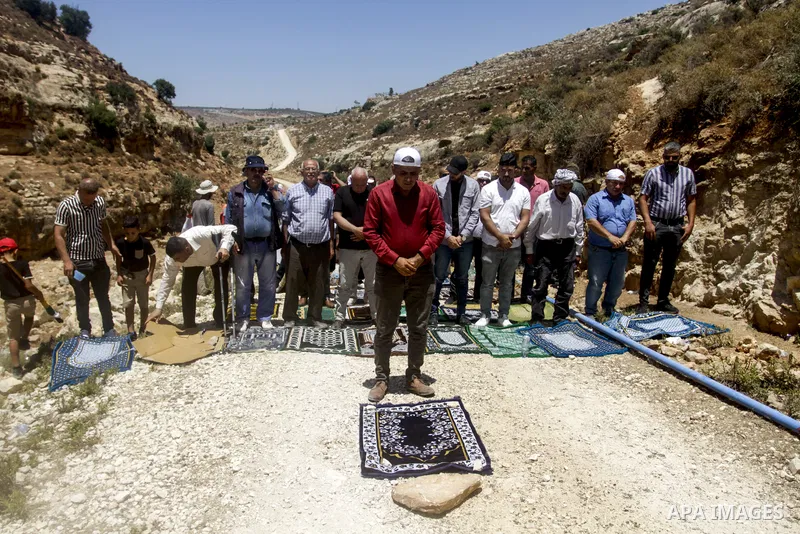 Palestinians take part in a protest following Friday prayer against settlement in the town of Deir Istiya, in the West Bank city of Salfit, on July 14, 2023. Israeli forces denied today access of Palestinian landlords in...