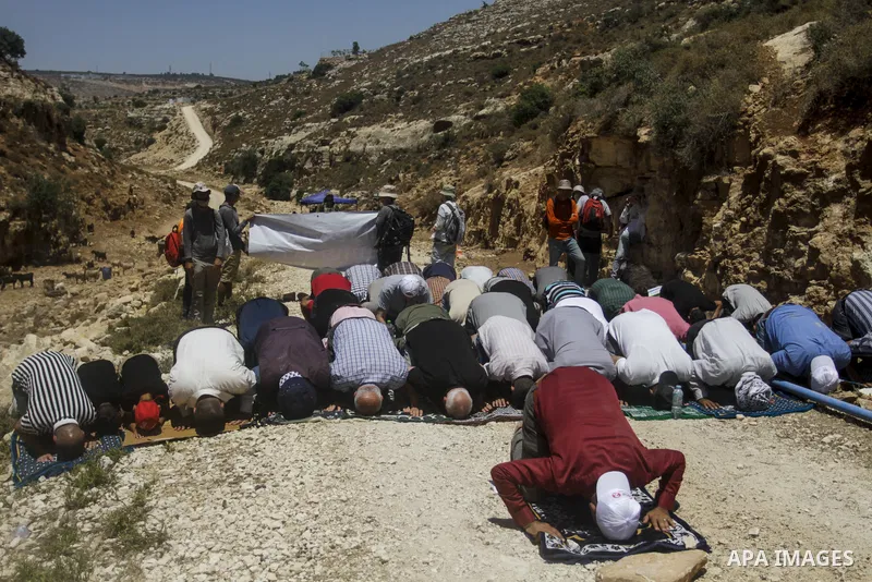 Palestinians take part in a protest following Friday prayer against settlement in the town of Deir Istiya, in the West Bank city of Salfit, on July 14, 2023. Israeli forces denied today access of Palestinian landlords in...