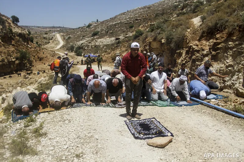 Palestinians take part in a protest following Friday prayer against settlement in the town of Deir Istiya, in the West Bank city of Salfit, on July 14, 2023. Israeli forces denied today access of Palestinian landlords in...