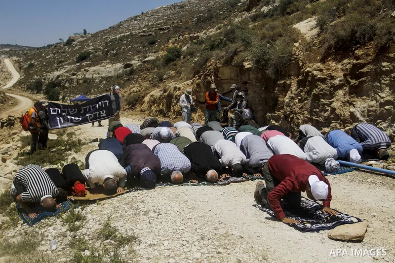 Palestinians take part in a protest following Friday prayer against settlement in the town of Deir Istiya, in the West Bank city of Salfit, on July 14, 2023. Israeli forces denied today access of Palestinian landlords in...
