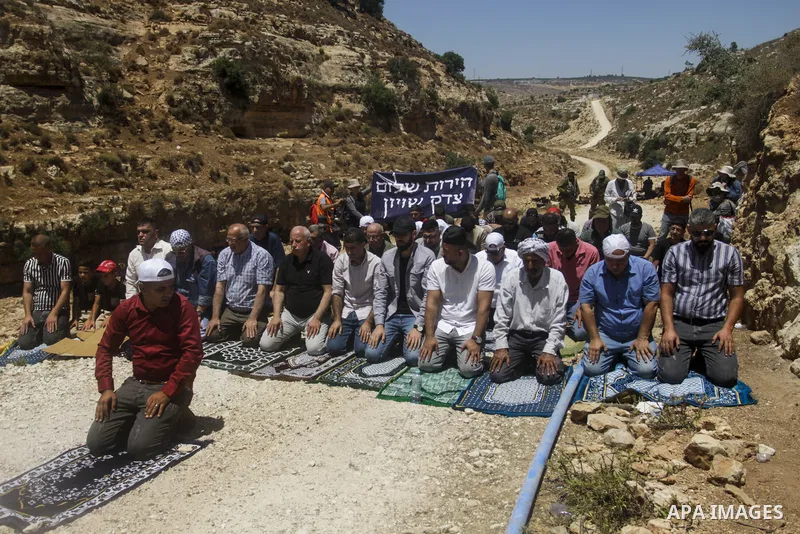 Palestinians take part in a protest following Friday prayer against settlement in the town of Deir Istiya, in the West Bank city of Salfit, on July 14, 2023. Israeli forces denied today access of Palestinian landlords in...