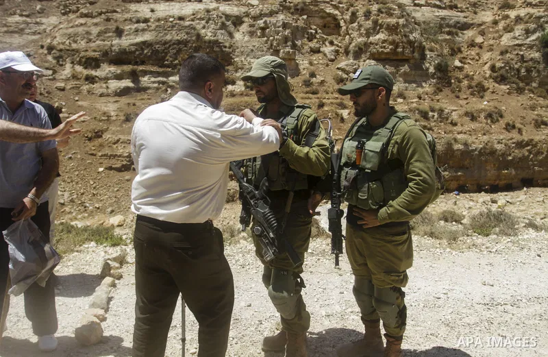 Palestinians take part in a protest following Friday prayer against settlement in the town of Deir Istiya, in the West Bank city of Salfit, on July 14, 2023. Israeli forces denied today access of Palestinian landlords in...