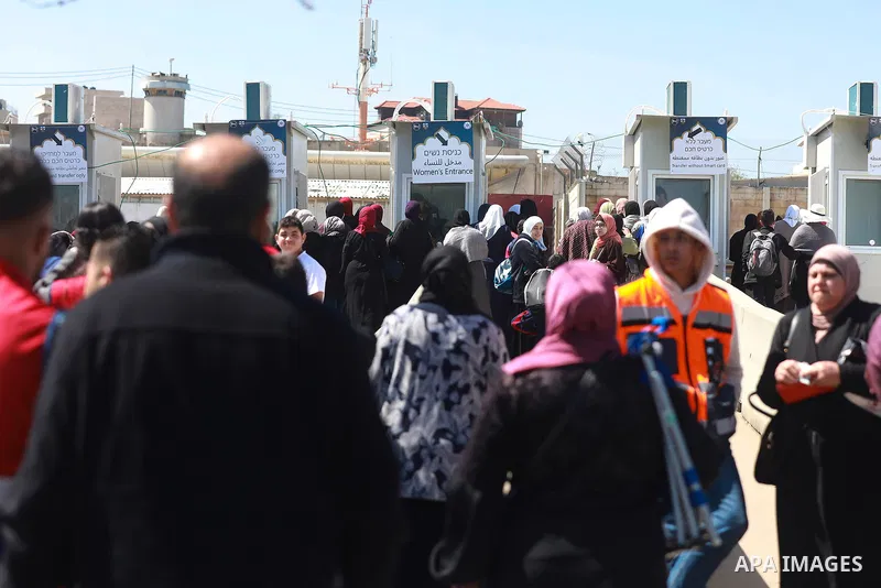 Palestinian worshippers pass the Qalandia checkpoint into Jerusalem to attend the fourth Friday prayer of the holy month of Ramadan at Al-Aqsa Mosque in Jerusalem's old city on April 14, 2023. Photo by Ahmad Arouri\ apai...