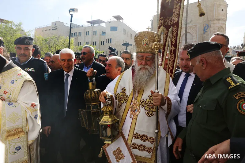 Metropolitan Vindictus, Patriarchal Representative for the Greek Orthodox in Bethlehem leads the celebration as the Holy Fire arrives to the Church of Nativity in Bethlehem in the West Bank on April 15,2023. Photo by Ahm...