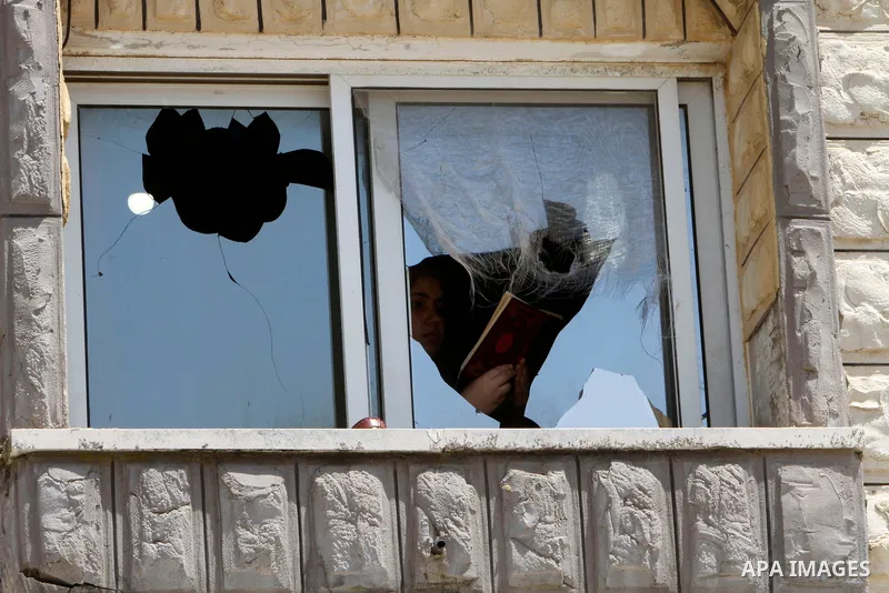 Palestinian homes that were damaged as a result of an attack by Jewish settlers in the town of Kufl Haris, east of Salfit, in the West Bank on April 17, 2023. Israeli settlers last night went on a rampage in the northern...