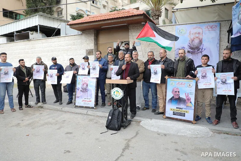 Palestinians take part in a protest in solidarity with prisoner on hunger strike Khader Adnan in front of Red Cross Office in Gaza city on April 30, 2023. The life of Khader Adnan is in peril as his hunger strike in Isra...