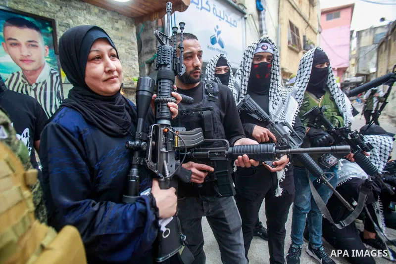Palestinian gunmen from the Balata brigade of the Al-Aqsa Martyrs Brigades armed group, rally during a memorial service of Palestinians who killed by Israeli forces in the Balata refugee camp in the West Bank on May 5, 2...